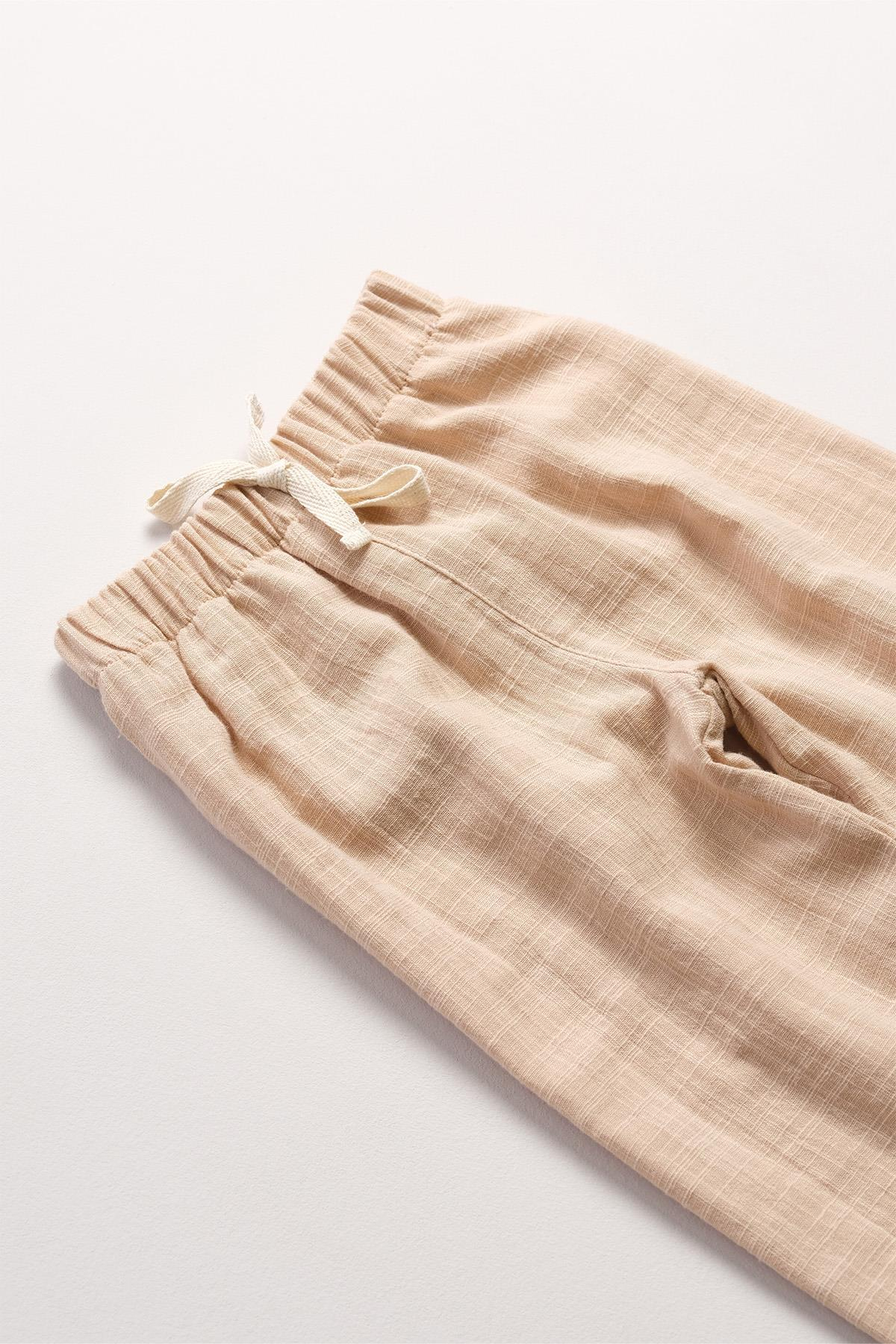 Bonderro Flamlı Müslin Bol Kesim Unisex Çocuk Pantolonu %100 PamukBonderro Flamlı Müslin Bol Kesim Unisex Çocuk Pantolonu %100 Pamuk