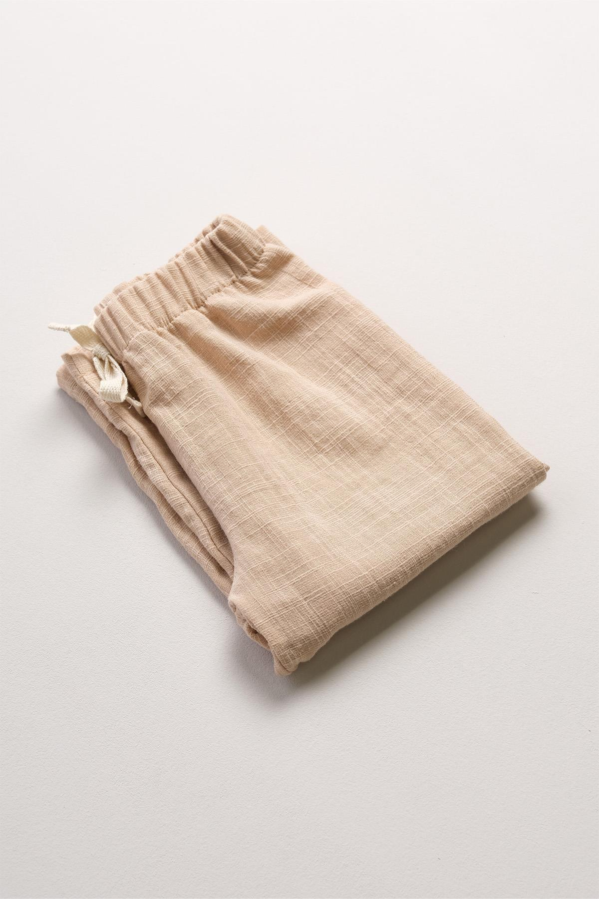 Bonderro Flamlı Müslin Bol Kesim Unisex Çocuk Pantolonu %100 PamukBonderro Flamlı Müslin Bol Kesim Unisex Çocuk Pantolonu %100 Pamuk