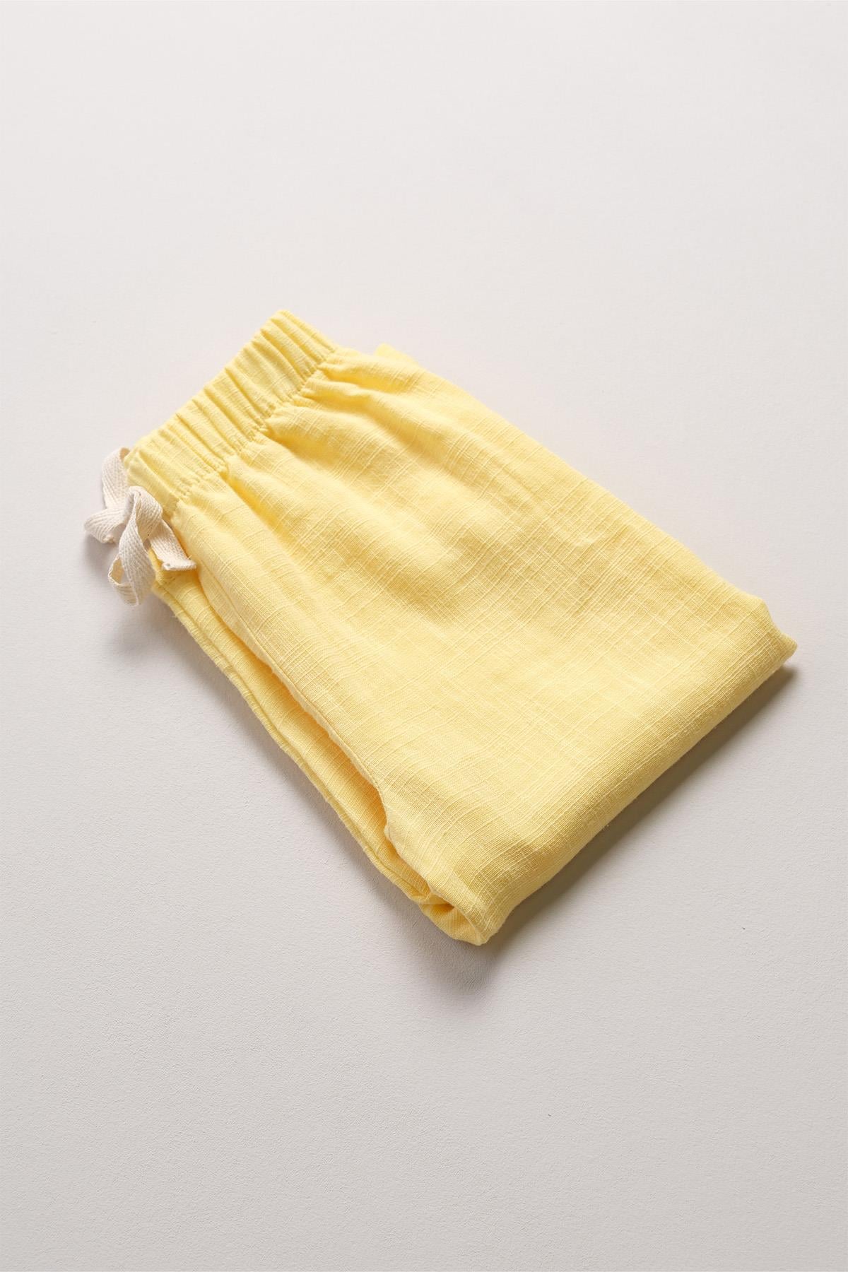 Bonderro Flamlı Müslin Bol Kesim Unisex Çocuk Pantolonu %100 PamukBonderro Flamlı Müslin Bol Kesim Unisex Çocuk Pantolonu %100 Pamuk