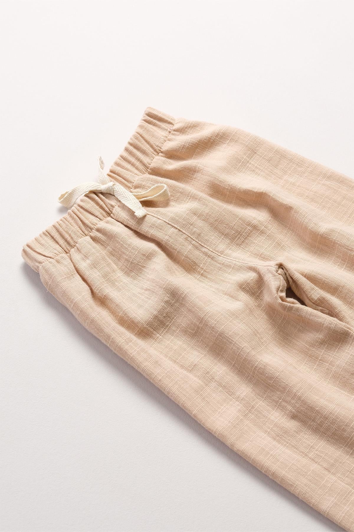 Bonderro Flamlı Müslin Bol Kesim Unisex Çocuk Pantolonu %100 PamukBonderro Flamlı Müslin Bol Kesim Unisex Çocuk Pantolonu %100 Pamuk