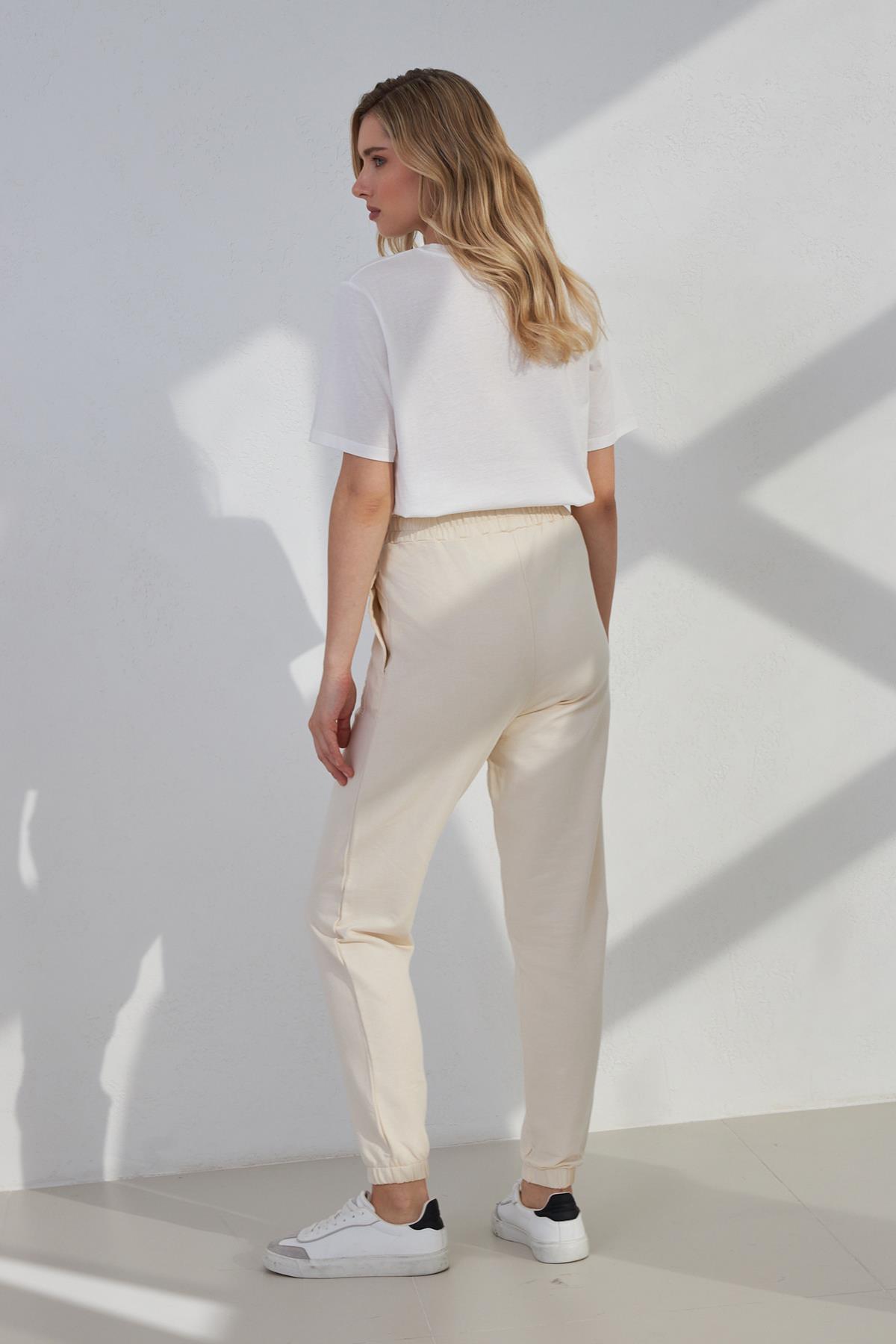 Krem Mini Baskı Detaylı Bilekten Lastikli Rahat Kesim Eşofman Altı Kadın Kategorisiz modelleri