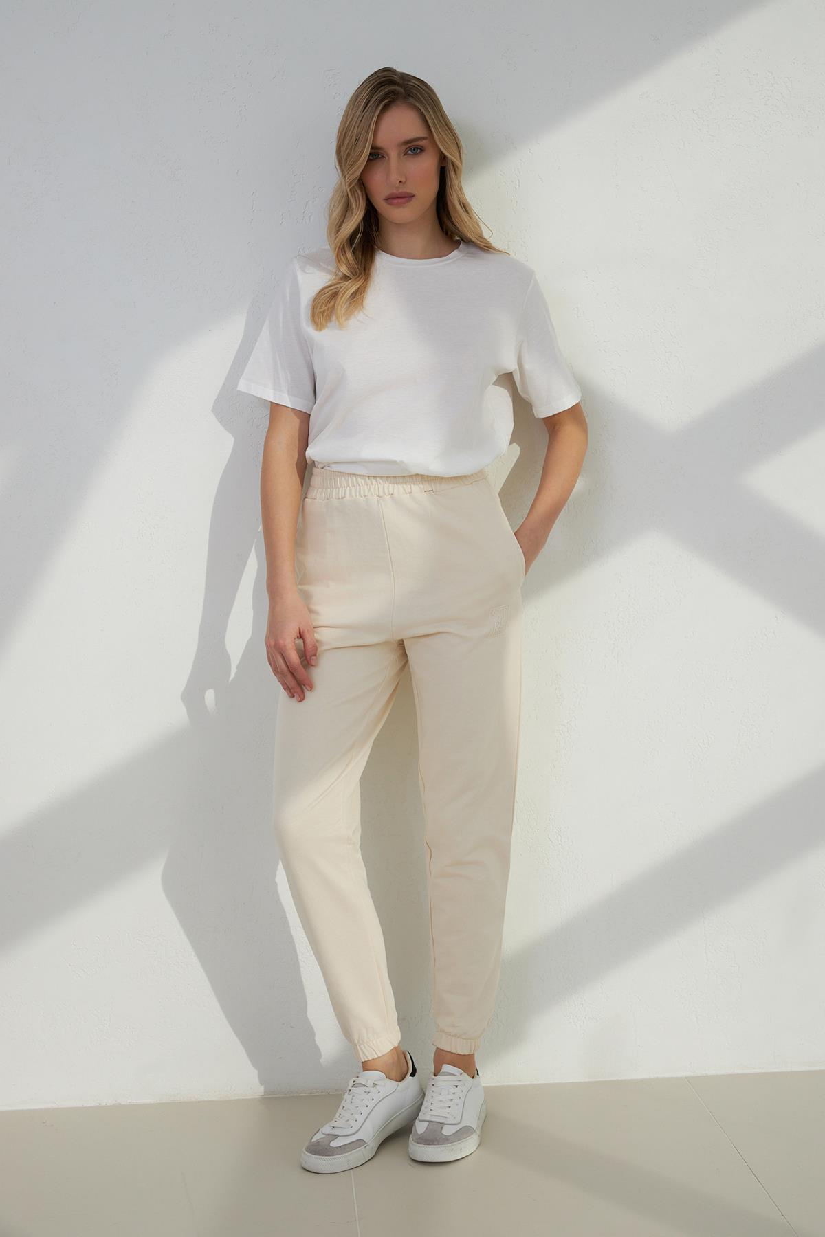 Krem Mini Baskı Detaylı Bilekten Lastikli Rahat Kesim Eşofman Altı Kadın Kategorisiz modelleri