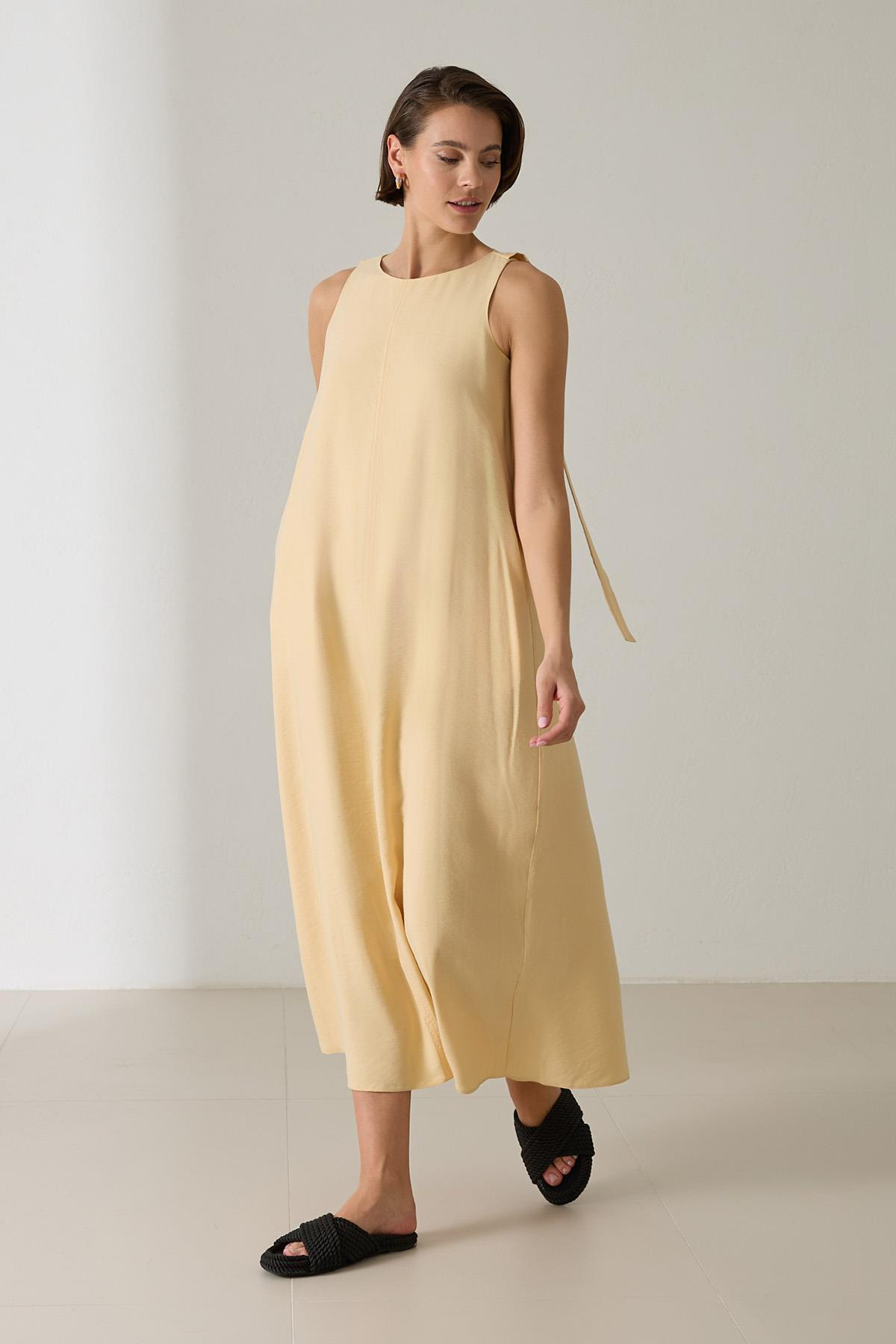 Tereyağ Sarısı Kolsuz Belden Kemer Detaylı Tam Kalıp Uzun Boy Elbise Kadın Kategorisiz modelleri