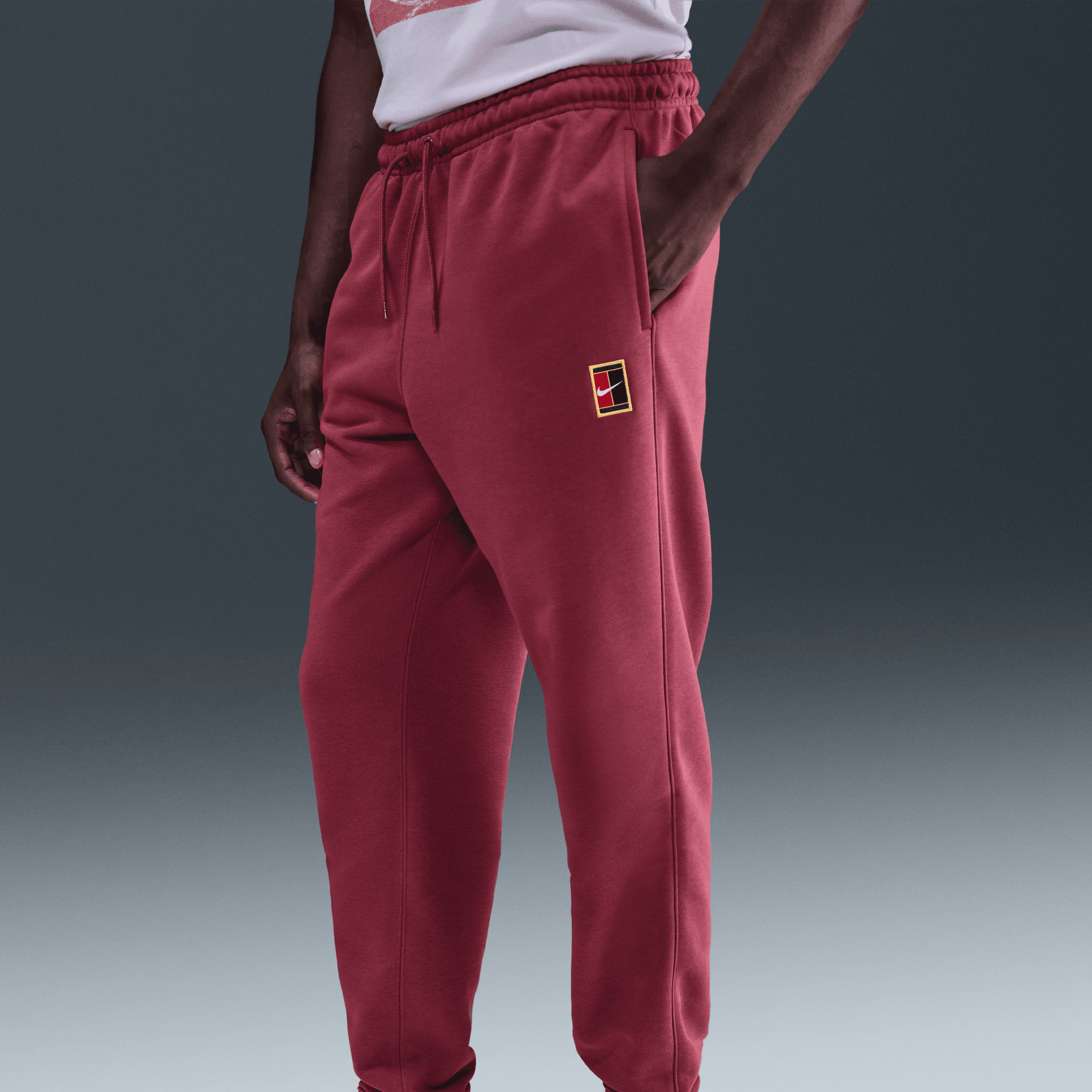 NikeCourt Heritage Dri-FIT Fleece Erkek Tenis Jogger'ı