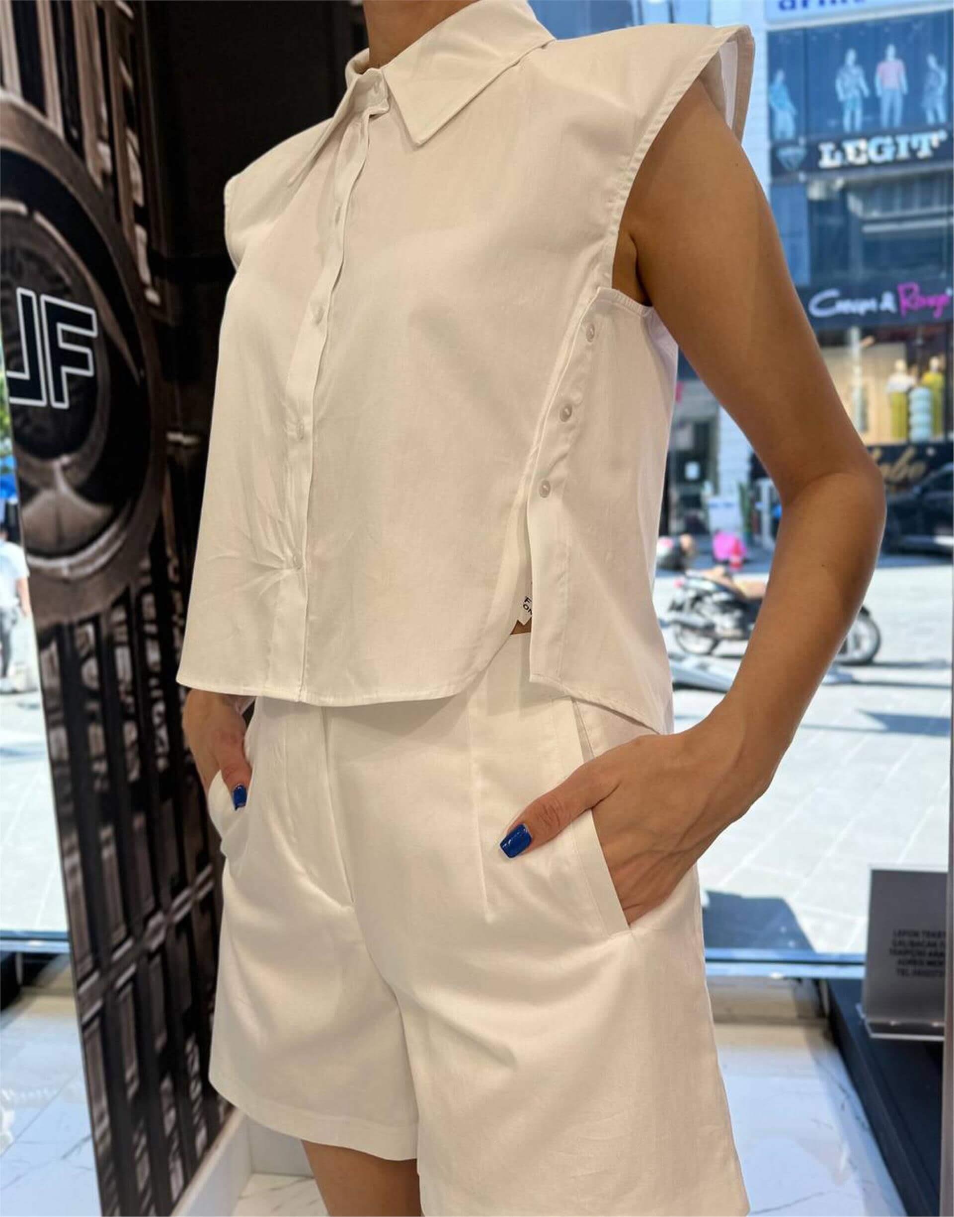 080476 SLEEVELESS BUTTON UP SHIRT WITH SIDE BUTTON DETAIL
