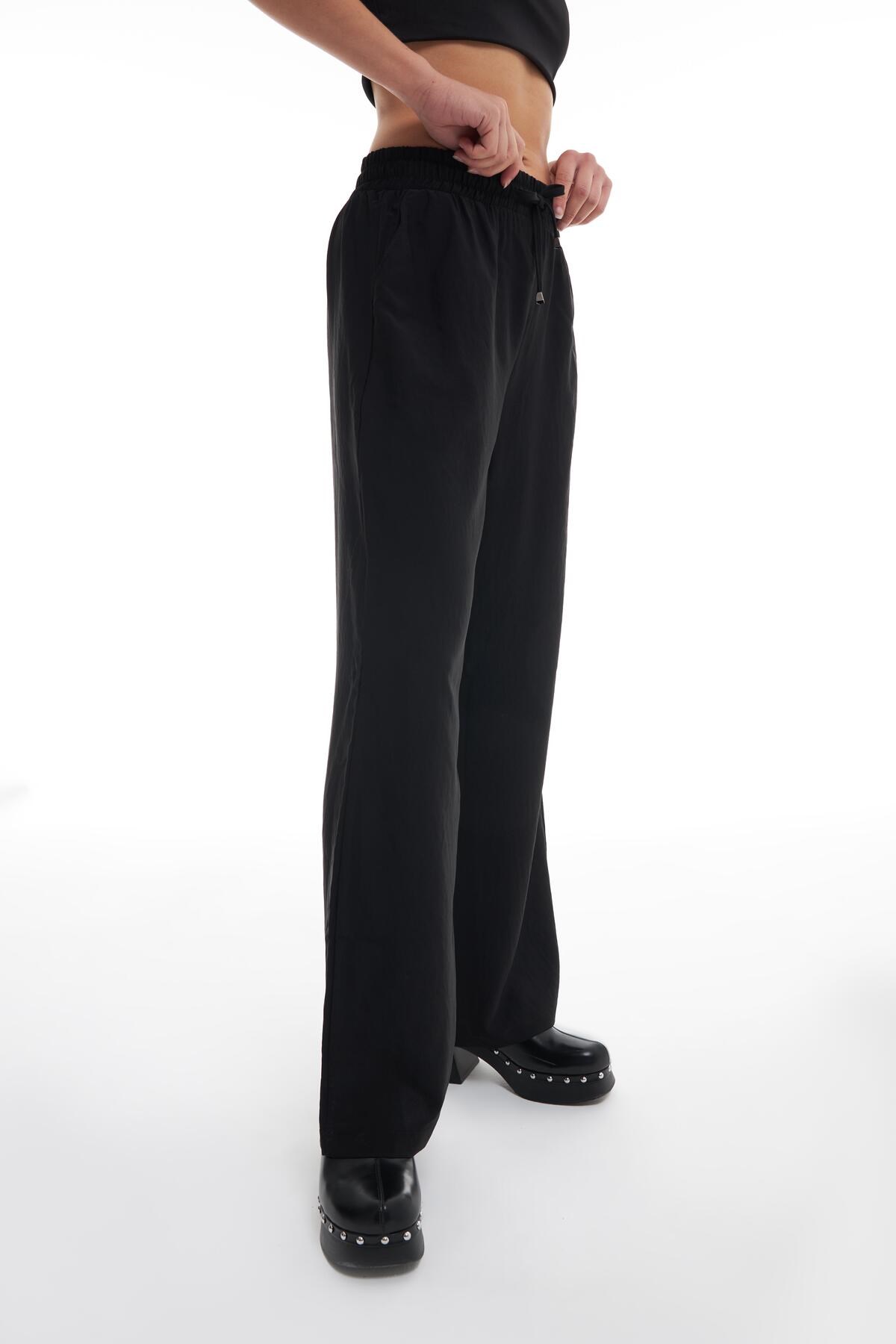 beli-lastikli-bol-paca-pantolon-siyah-70b7-4.jpg