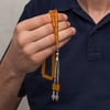 Metal Püsküllü 7x11 mm Kesme Sıkma Kehribar Tesbih