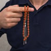 Metal Püsküllü 7x11 mm Turuncu Sıkma Kehribar Tesbih