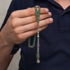 Metal Püsküllü Deniz Yeşili Kesme Sıkma Kehribar Tesbih