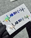 HLGBT48 Hologram Kalp Ritmi Desenli AB Rh Negatif (-) Kan Grubu Etiketi 2 li Set