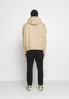 Önü Küçük Logolu Oversize Kapşonlu Sweat-Bej