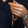 Gümüş Püsküllü Sarı Kapsül Kesim Sıkma Kehribar Tesbih