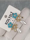 Kolyeli new32 küpe (14 ayar altın rengi)
