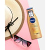 NIVEA Q10 Sıkılaştırıcı ve Bronzluk Vücut Losyonu 200ml,10 Günde Sıkılaştırıcı Krem,Doğal Bronzluk,Açık & Buğday Tenli Cilt