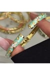 XUPİNG MİNELİ TURKUAZ PİRİNÇ KAPLAMA ÇİÇEK MOTİFLİ ZİRKON TAŞ DETYALI GOLD KADIN KELEPÇE BİLEKLİK