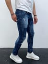 Erkek Mavi Slim Fit Yıpratılmış ve Boya Detaylı Denim Pantolon – Modern Sokak Stili, Rahat Kesim