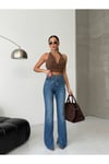 Kadın Yüksek Bel Çapraz Bel Detaylı Bol Paça Mavi Denim Jean Pantolon