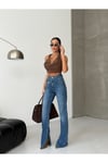 Kadın Yüksek Bel Çapraz Bel Detaylı Bol Paça Mavi Denim Jean Pantolon