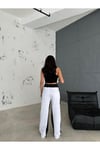 BEYAZ BAGGY PANTOLON YANLARI SİYAH DETAY ŞERİTLİ BELİ LASTİKLİ