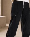Erkek Keten Kumaş Asimetrik Ve Cep Kapağı Detaylı Baggy Pantolon