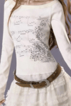 Ekru Nota Desenli Uzun Kollu Crop