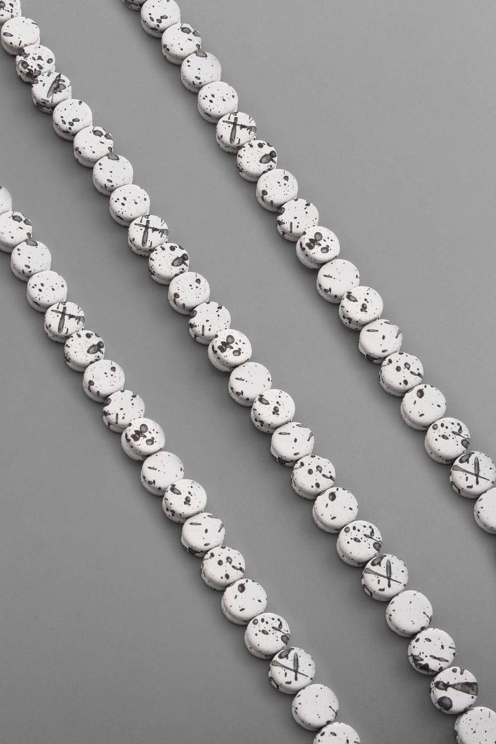 Hematite Natural Stone Mottled White Circle Cut 8x4mm String Of Beads