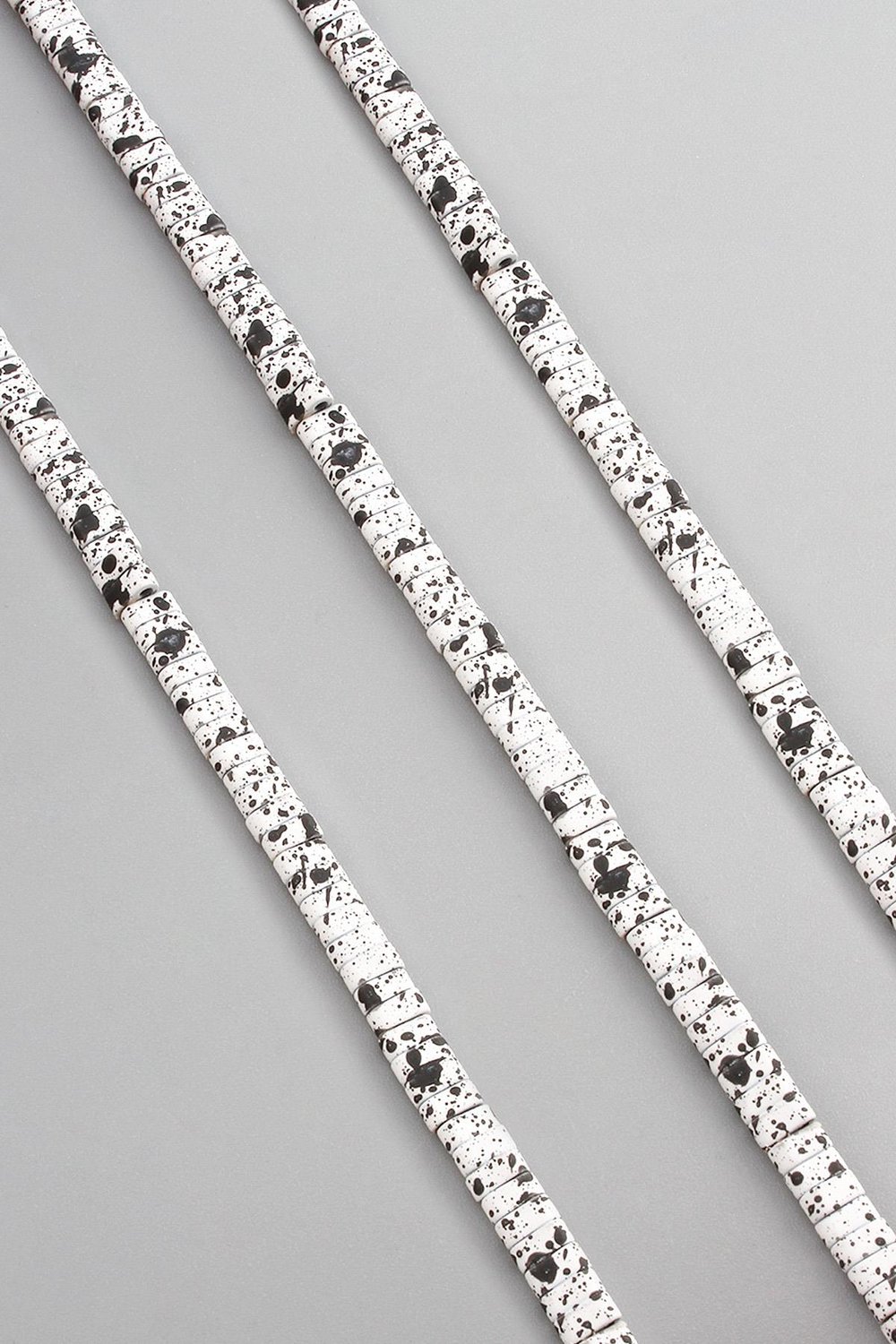 Hematite Natural Stone Matte Mottled White Double Hole 4x2mm String Of Beads