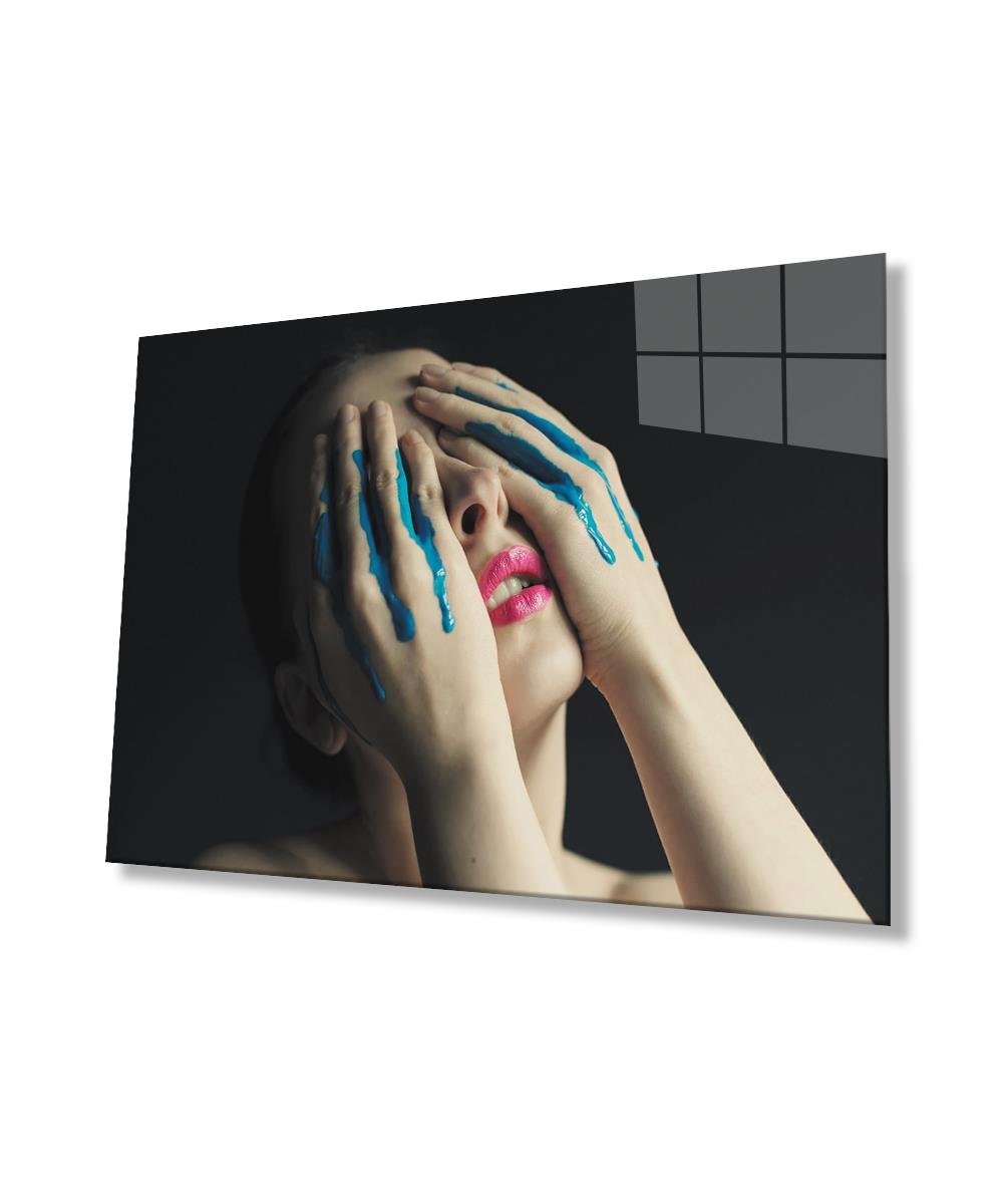 Mavi Boya Akan Elle Yüzünü Kapatan Kadın Cam Tablo  4mm Dayanıklı Temperli Cam, Woman Covering Her Face with Flowing Blue Paint Glass Wall Art