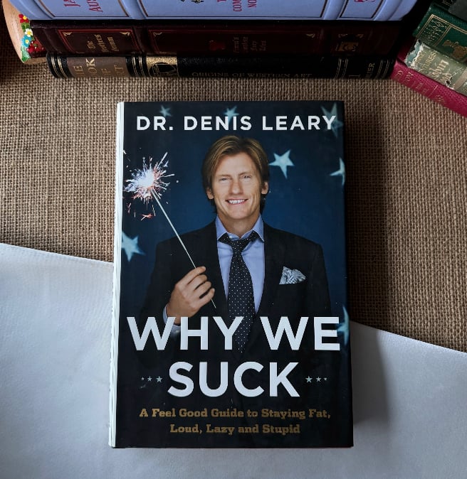 Why We Suck: A Feel Good Guide to Staying Fat, Loud, Lazy and Stupid