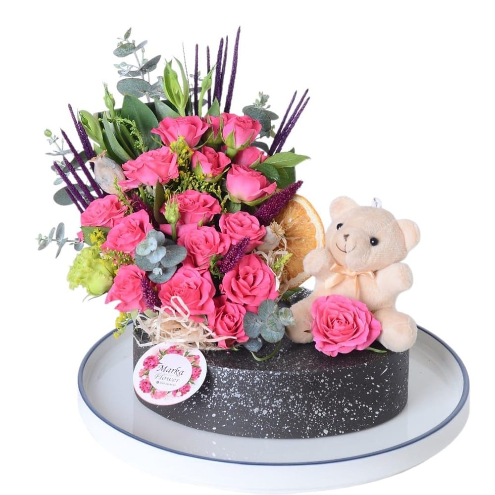 Pink Garden Roses in a boat-patterned pot