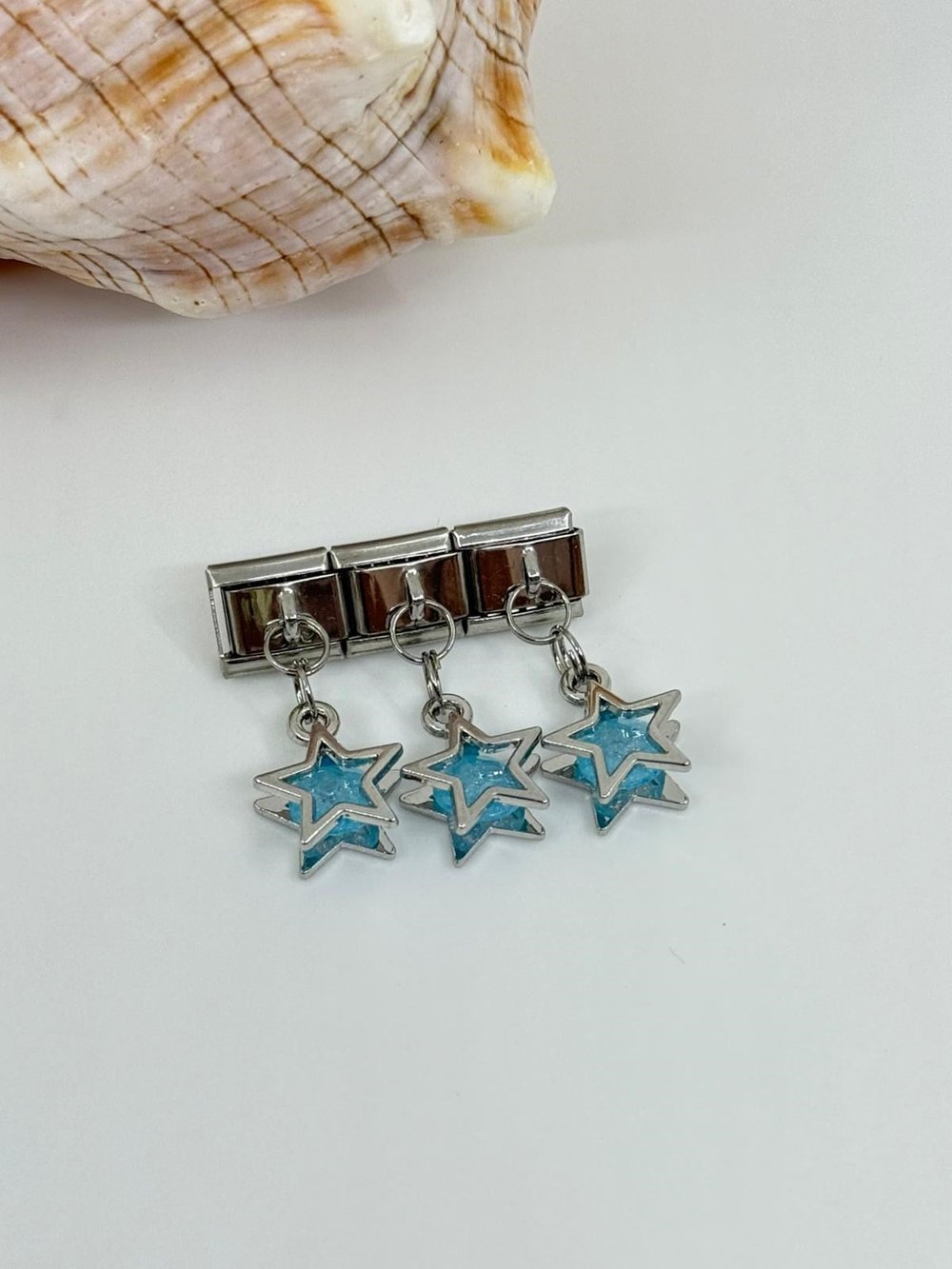 Nomi charm