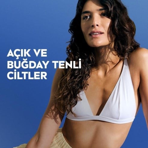 NIVEA Q10 Sıkılaştırıcı Ve Kademeli Bronzlaştırıcı Vücut Losyonu 400ml