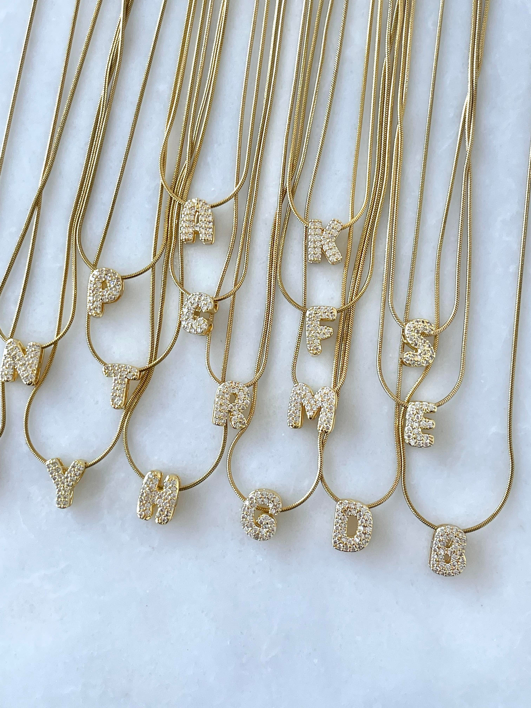 Çelik Gömme Taşlı Harf Kolye Gold