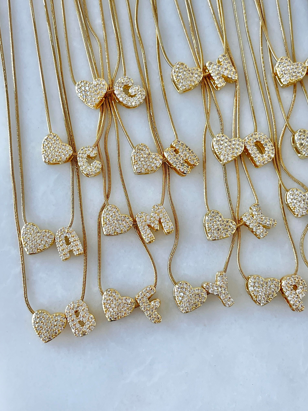 Çelik Gömme Taşlı Kalpli Harf Kolye Gold