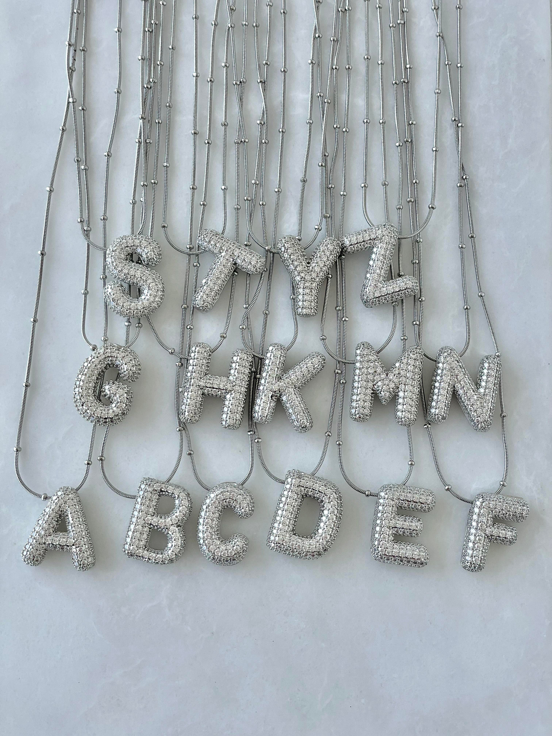 Çelik Gömme Taşlı Bombeli Harf Kolye Gümüş