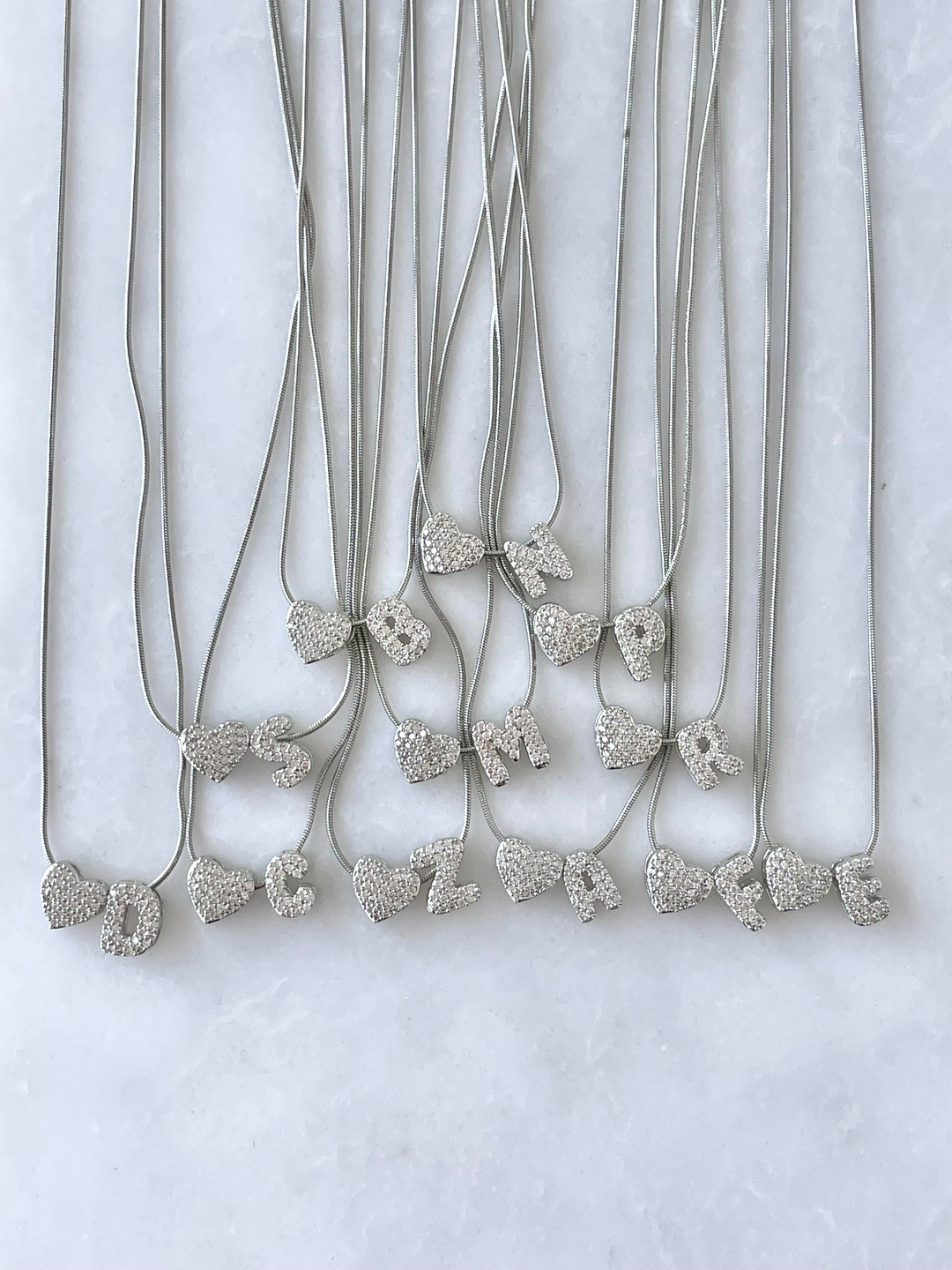 Çelik Gömme Taşlı Kalpli Harf Kolye Gümüş