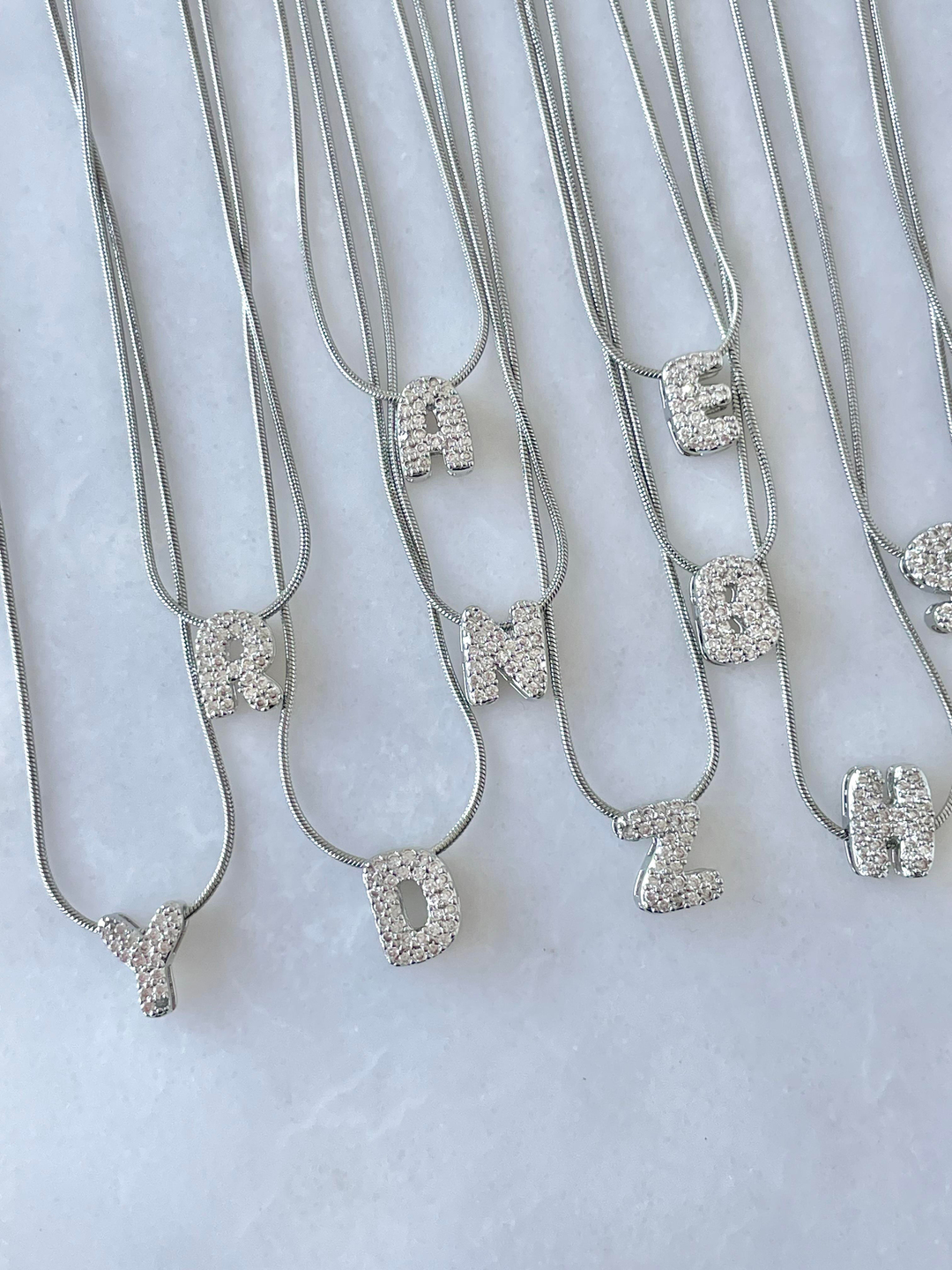 Çelik Gömme Taşlı Harf Kolye Gümüş