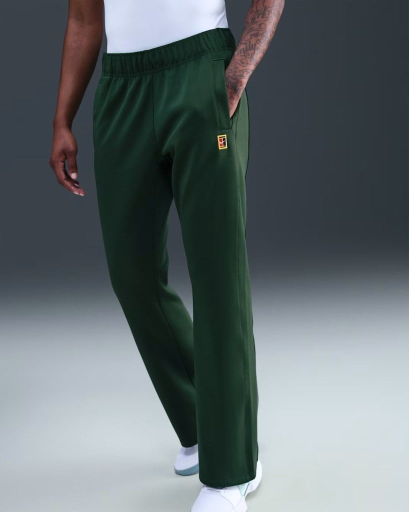 NikeCourt FZ6509-323 Heritage Windrunner Normal Belli Kadın Tenis Pantolonu - Yeşil