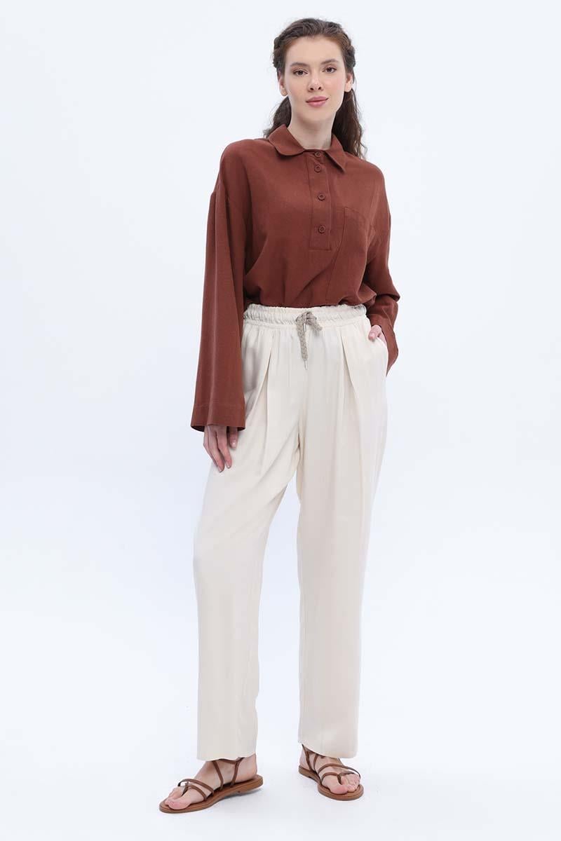 Pantalon large écru à taille élastique