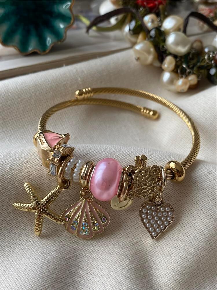 Çelik Gold Kordonlu Pembe Kabuklu Denizyıldızı Charmlı Bileklik