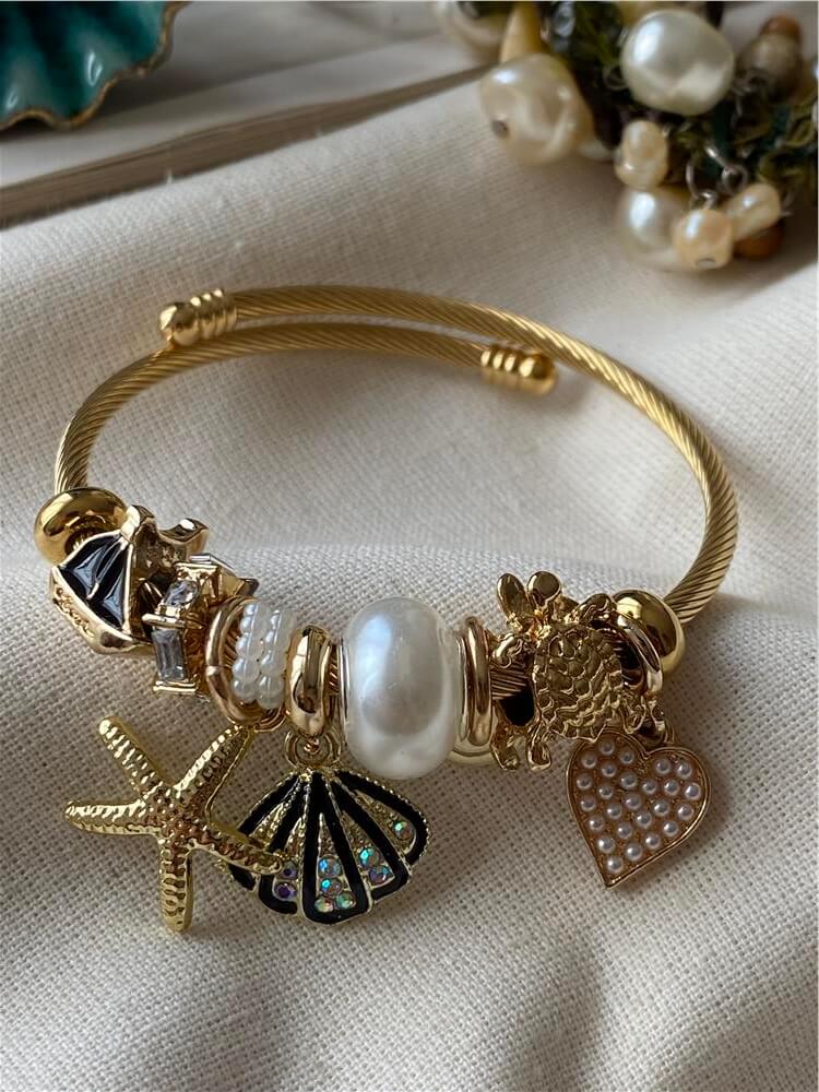 Çelik Gold Kordonlu Siyah Kabuklu Denizyıldızı Charmlı Bileklik