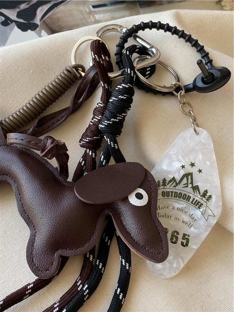 Kordon Detaylı Koyu Kahverengi Köpek Çanta Charmı