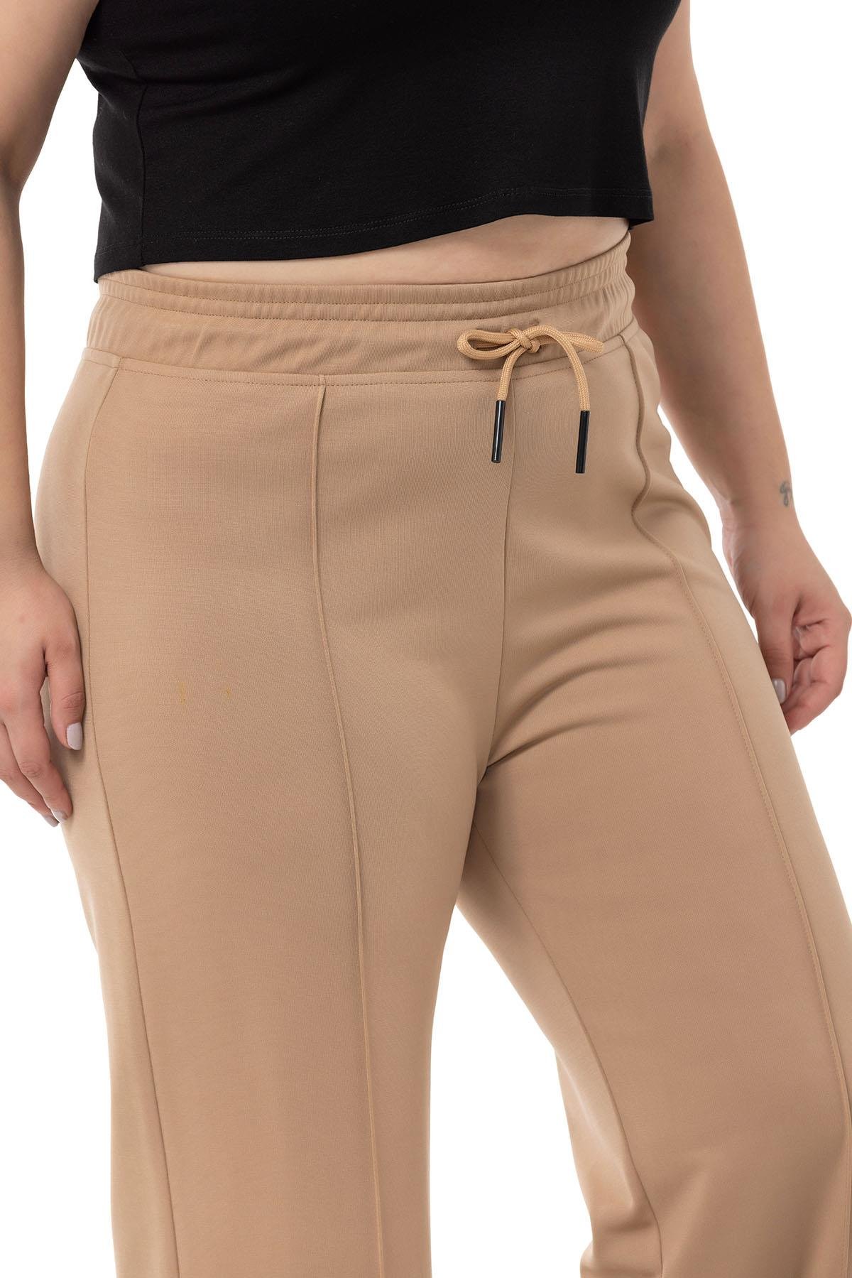 PantolonDISENTIS, BÜYÜK BEDEN, GENÇ BÜYÜK BEDEN, BIG SIZEDISENTIS MODESTBüyük Beden Beli Lastikli ve İp Büzgülü Nervür Dikişli Bol Paça Vizon Pantolon