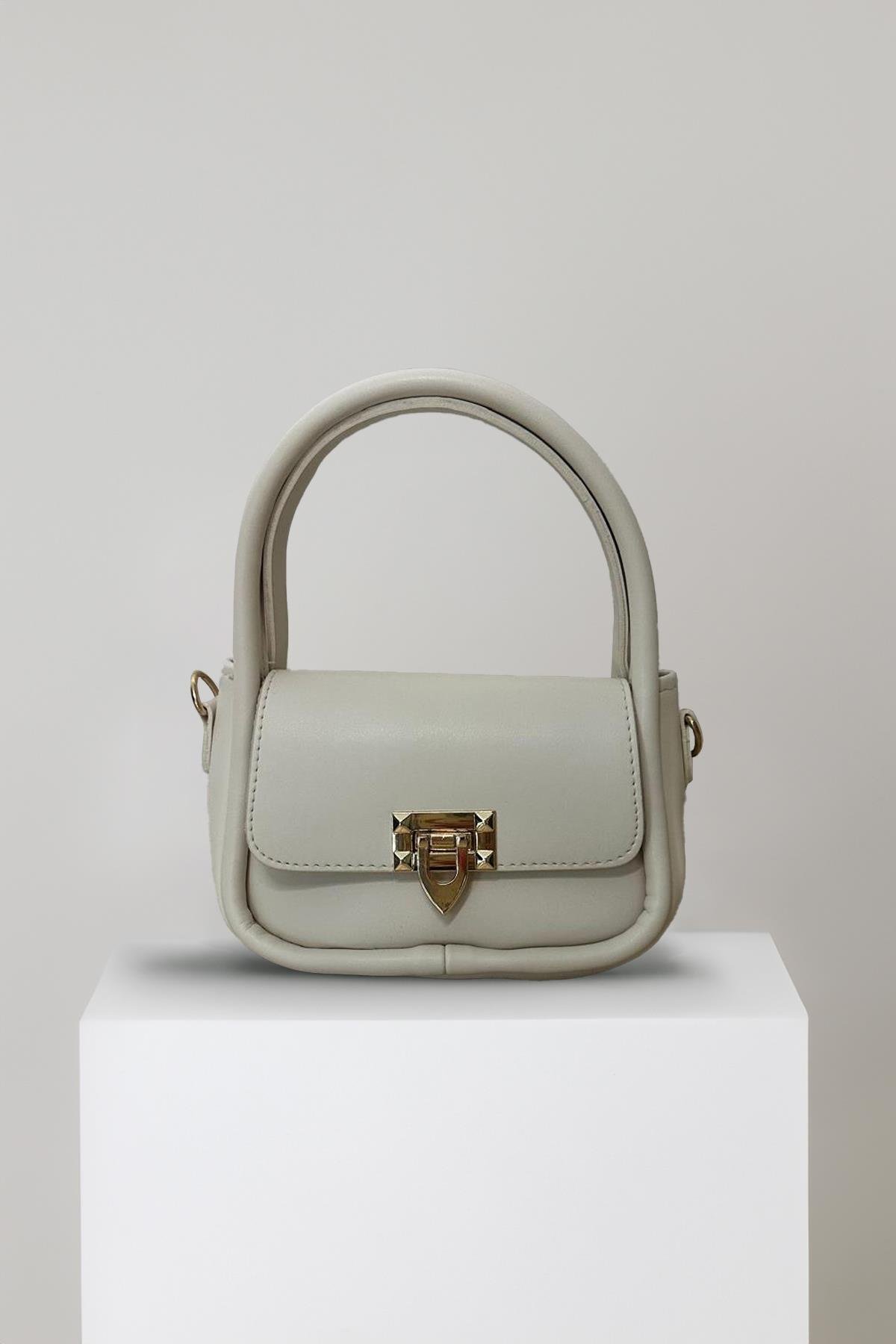 Mgebutik Bej Kadın Kapaklı Mini Çapraz Askılı El ve Omuz ÇantasıMgebutik Bej Kadın Kapaklı Mini Çapraz Askılı El ve Omuz Çantası