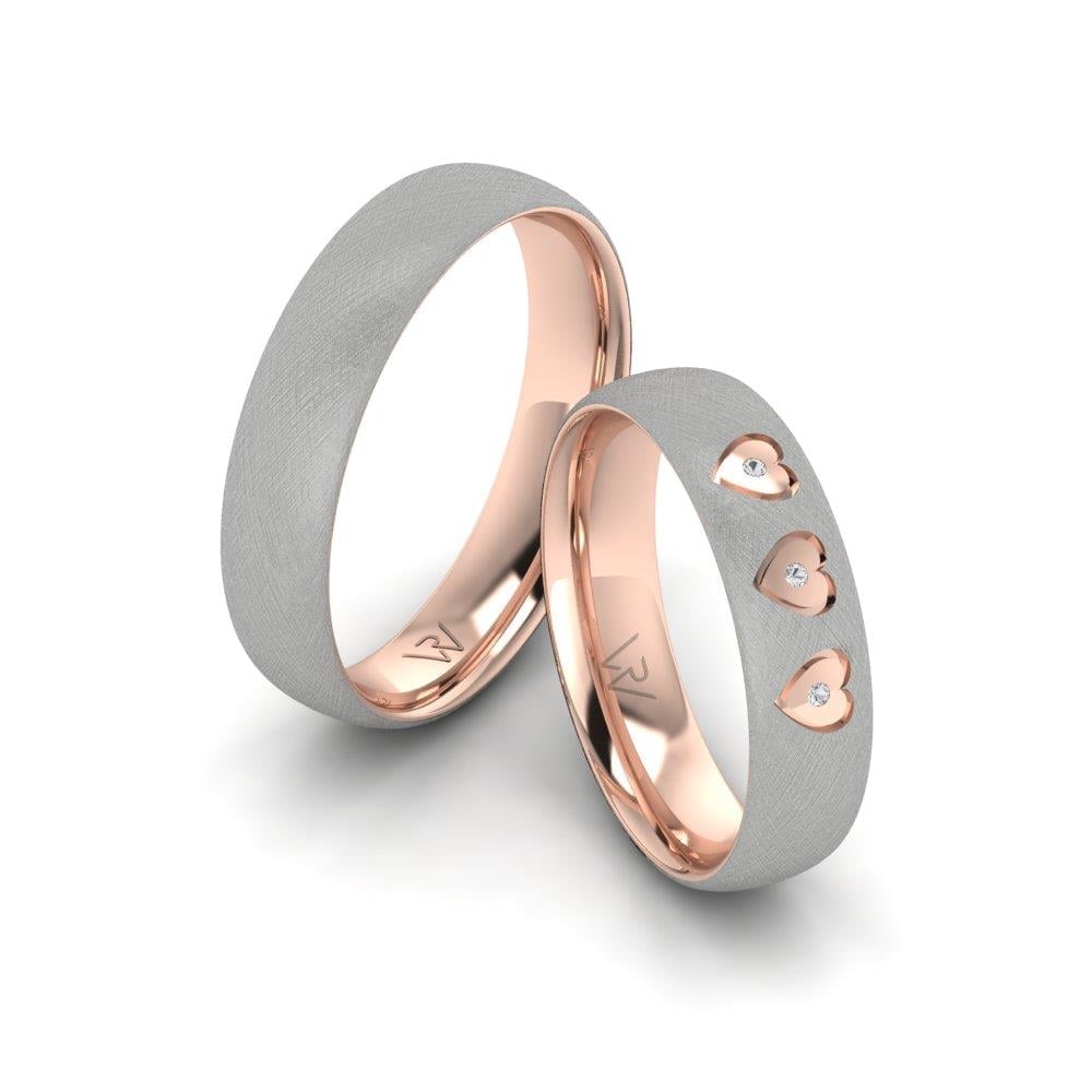 Eheringe mit Radiantia-Steinen in Roségold und weißem Kristall von Dalloz