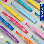 Curaprox 1006 diş fırçası, çeşitli renklerde