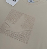 BYMN BEJ KABARTMALI DESEN VE TAŞ DETAYLI KADIN TSHIRT 