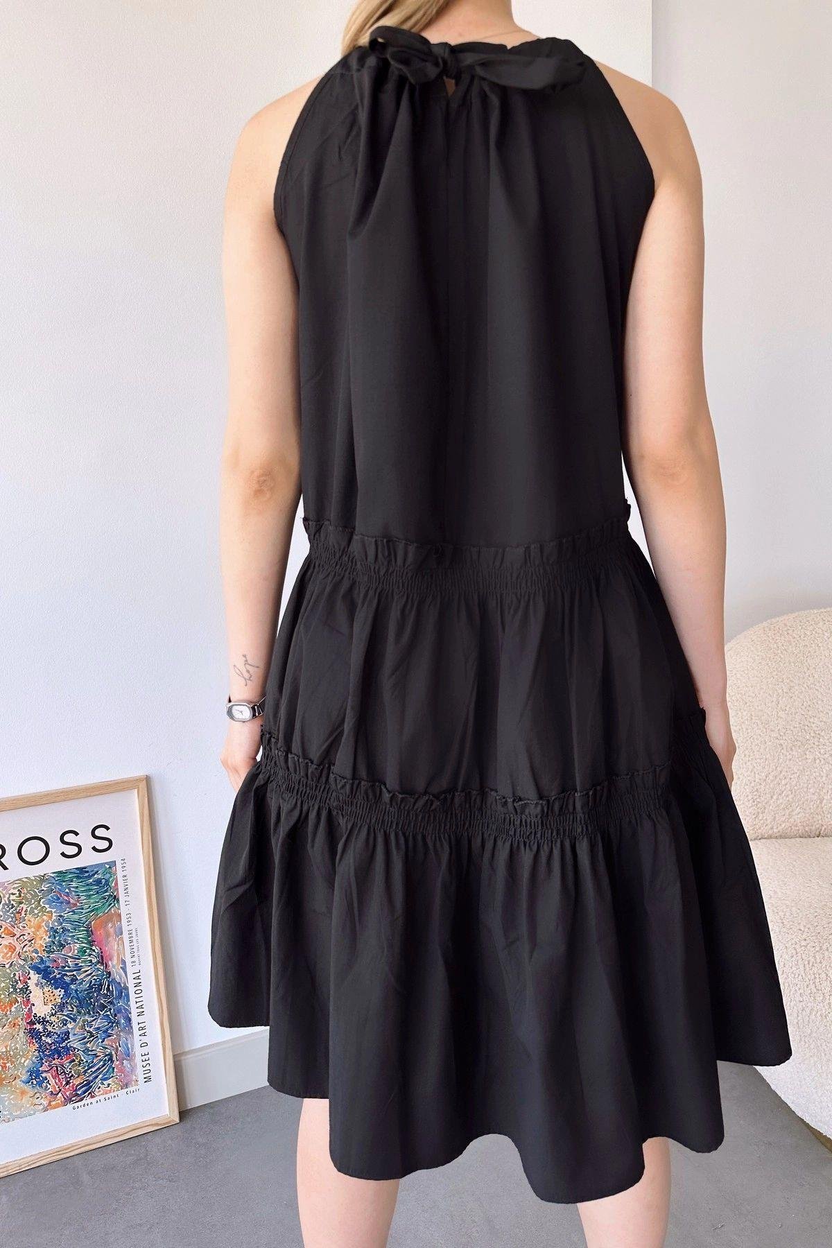 siyah-halter-midi-elbise-1a4-4f.jpg