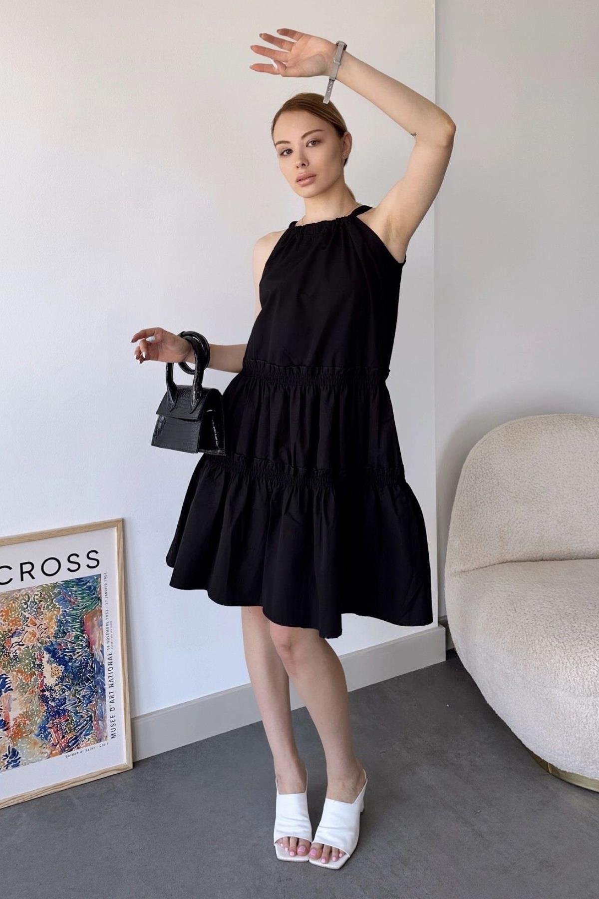 siyah-halter-midi-elbise-b7b9aa.jpg