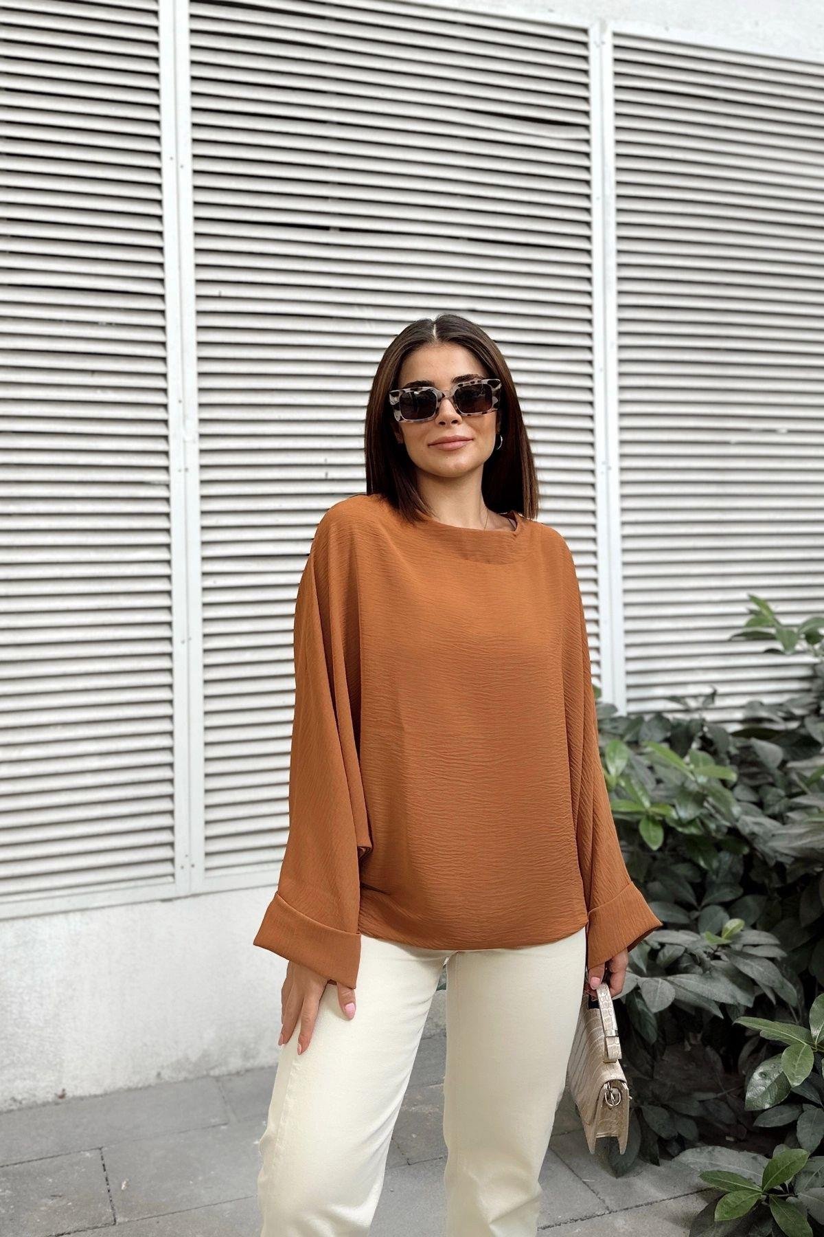 taba-airobin-salas-bluz-61a84d.jpg